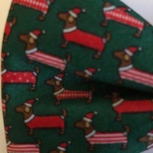 Green bow tie with dogs in red outfits